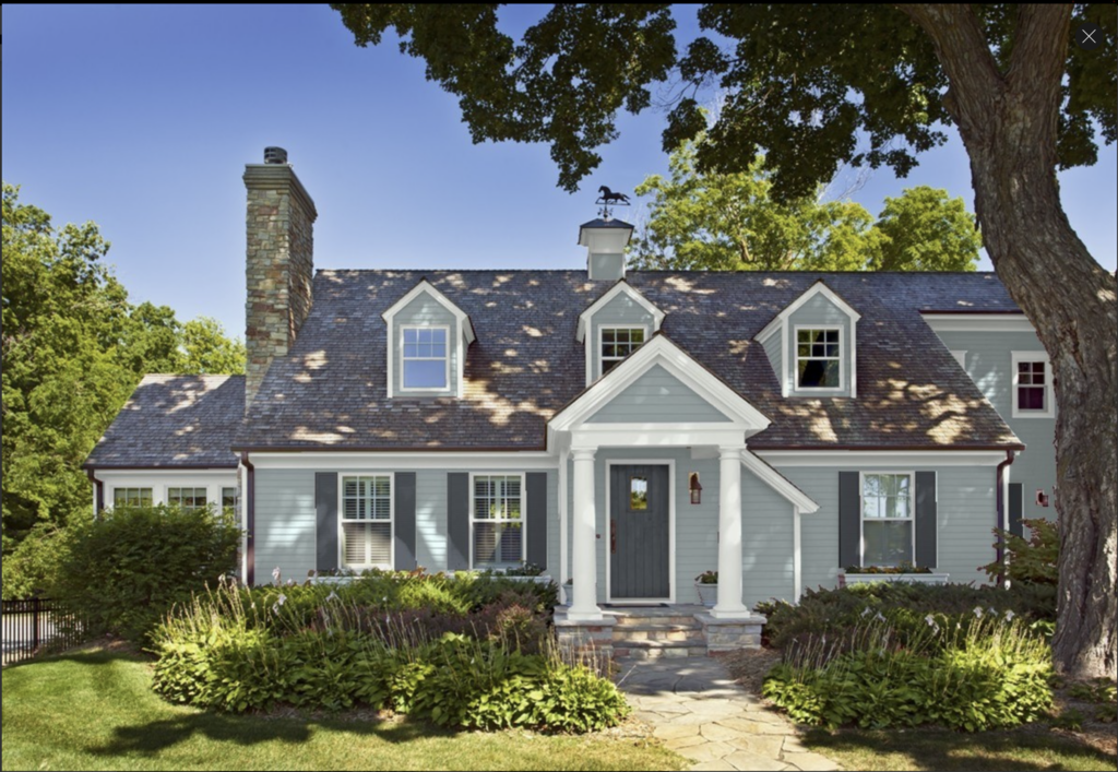 exterior of a house with Brewster Gray clapboards, Wickham Gray trim and Witching Hour on the door and shutters