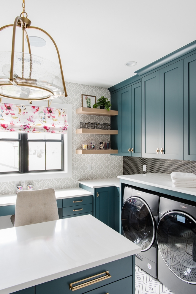 deep teal cabinets in a laundry room