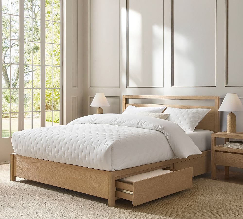 a serene bedroom setting with large windows and greige walls
