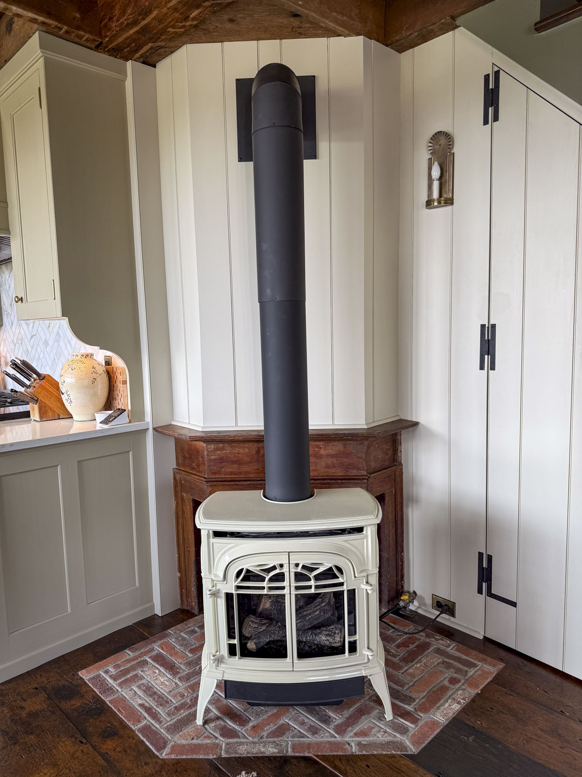 an antique hearth with warm reddish tones and brick fireplace hearth call for low chroma paint colors