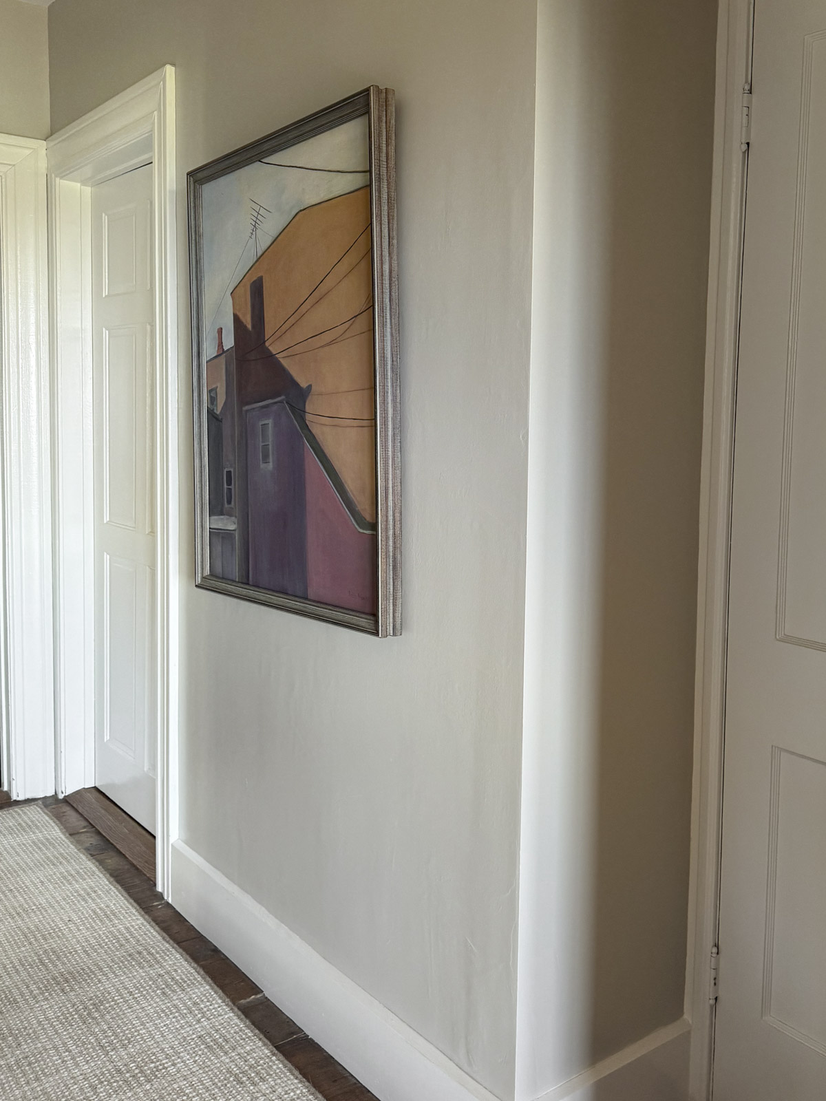 ballet white can appear quite gray at times depending on the lighting. Here it is shown in our hallway where it doesn't get direct light. In this space it looks like a muted taupe.