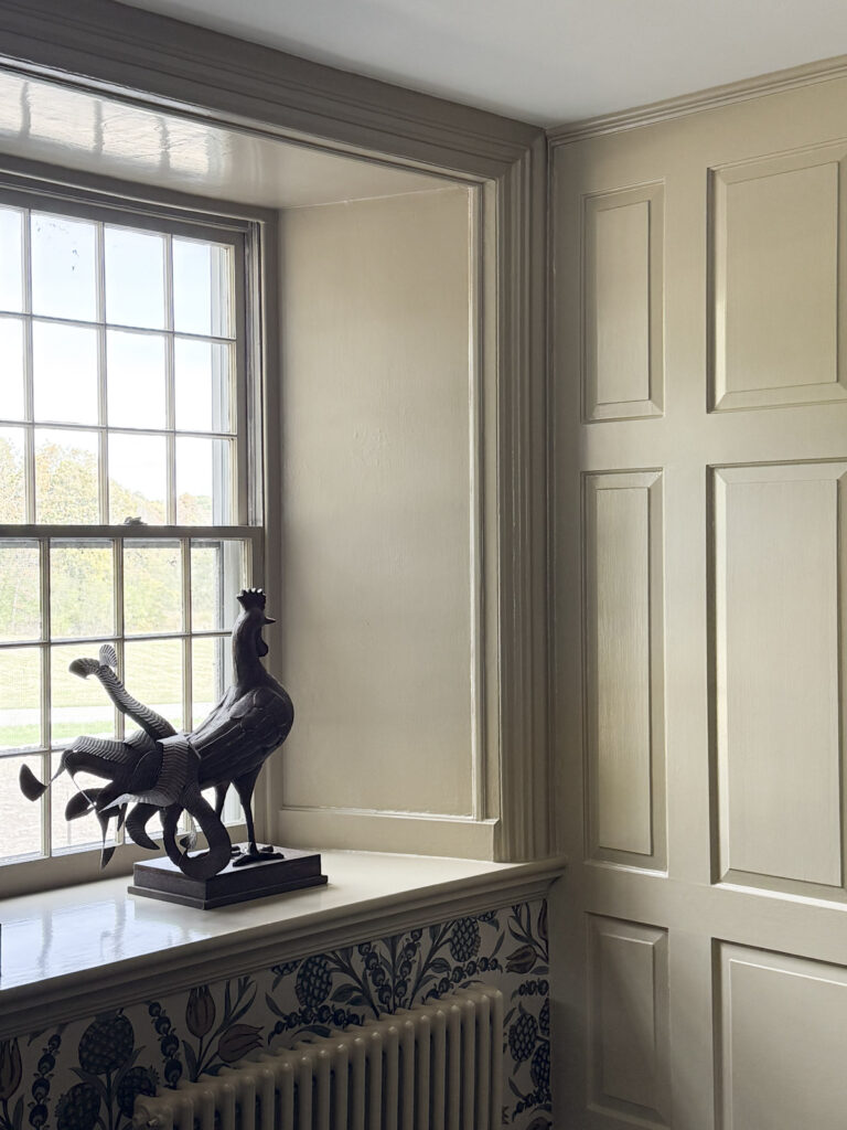 universal khaki on a wooden paneled wall and window sill