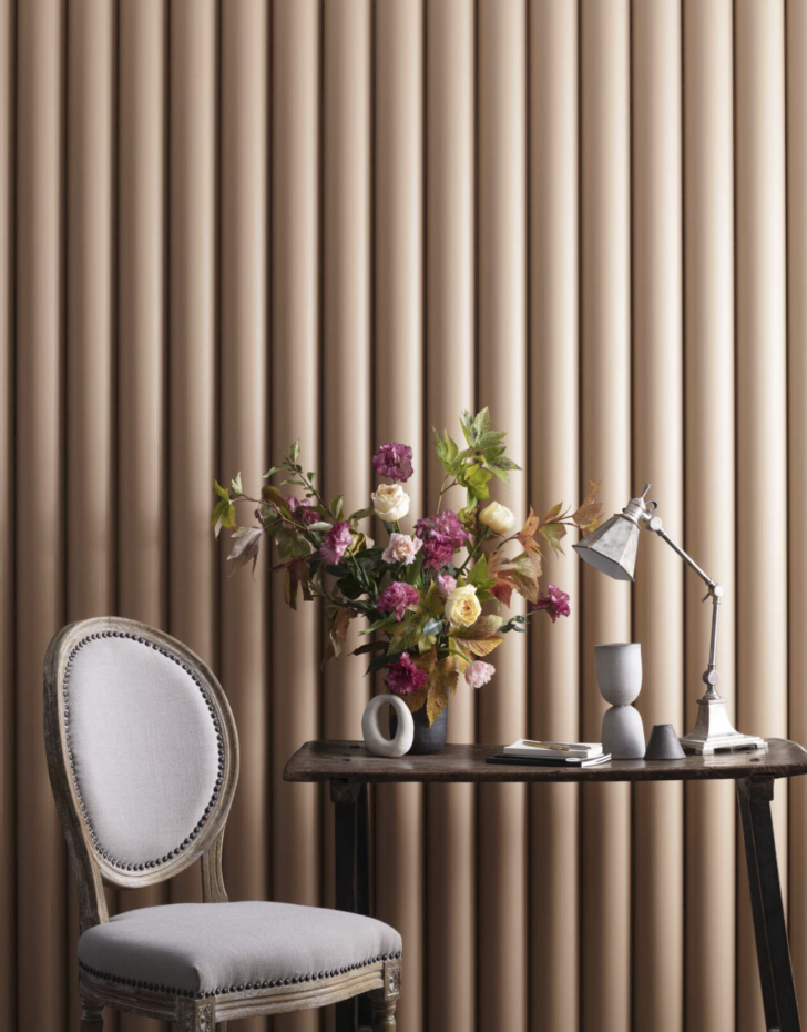nubuck on the scalloped detail wall with a seating area and flower arrangement
