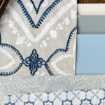 A flatlay of blues, gray and white including fabric, wallpaper, paint and hard surface materials