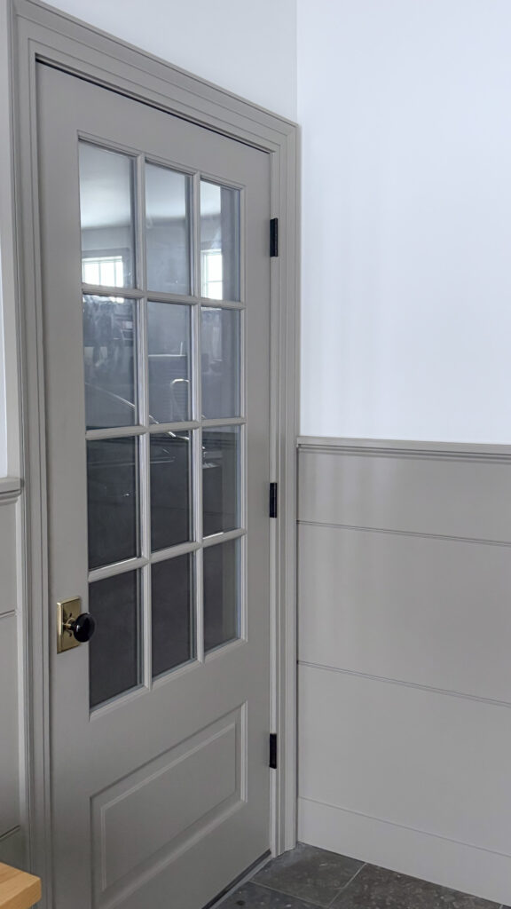 taupe wainscoting and door