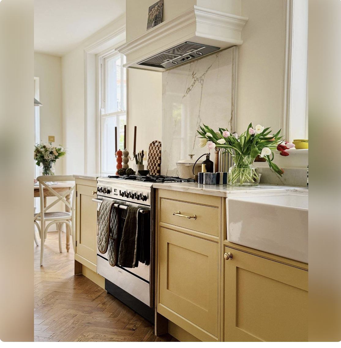 yellow cabinetry with apron front sink