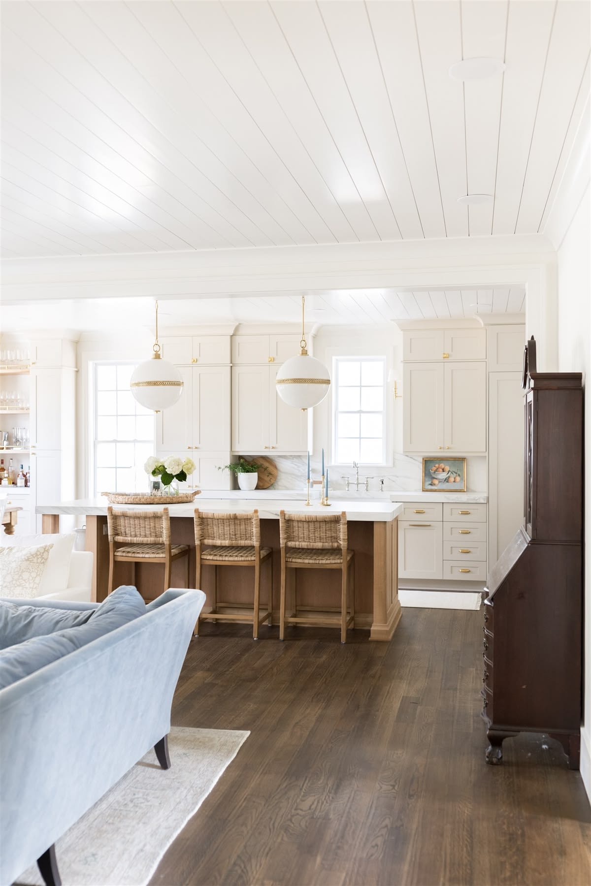 This bright first floor blends white with accessible beige cabinets from The Coastal Oak
