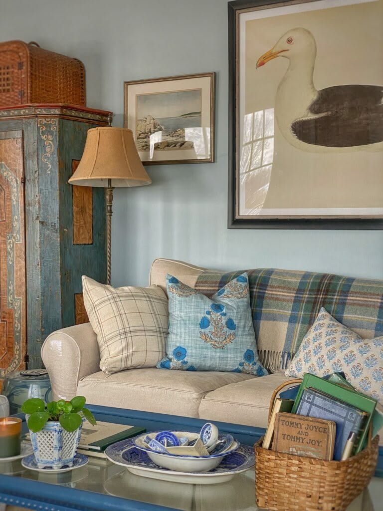 Molly in Maine's living room with aqua gray walls and soft vintage furnishings
