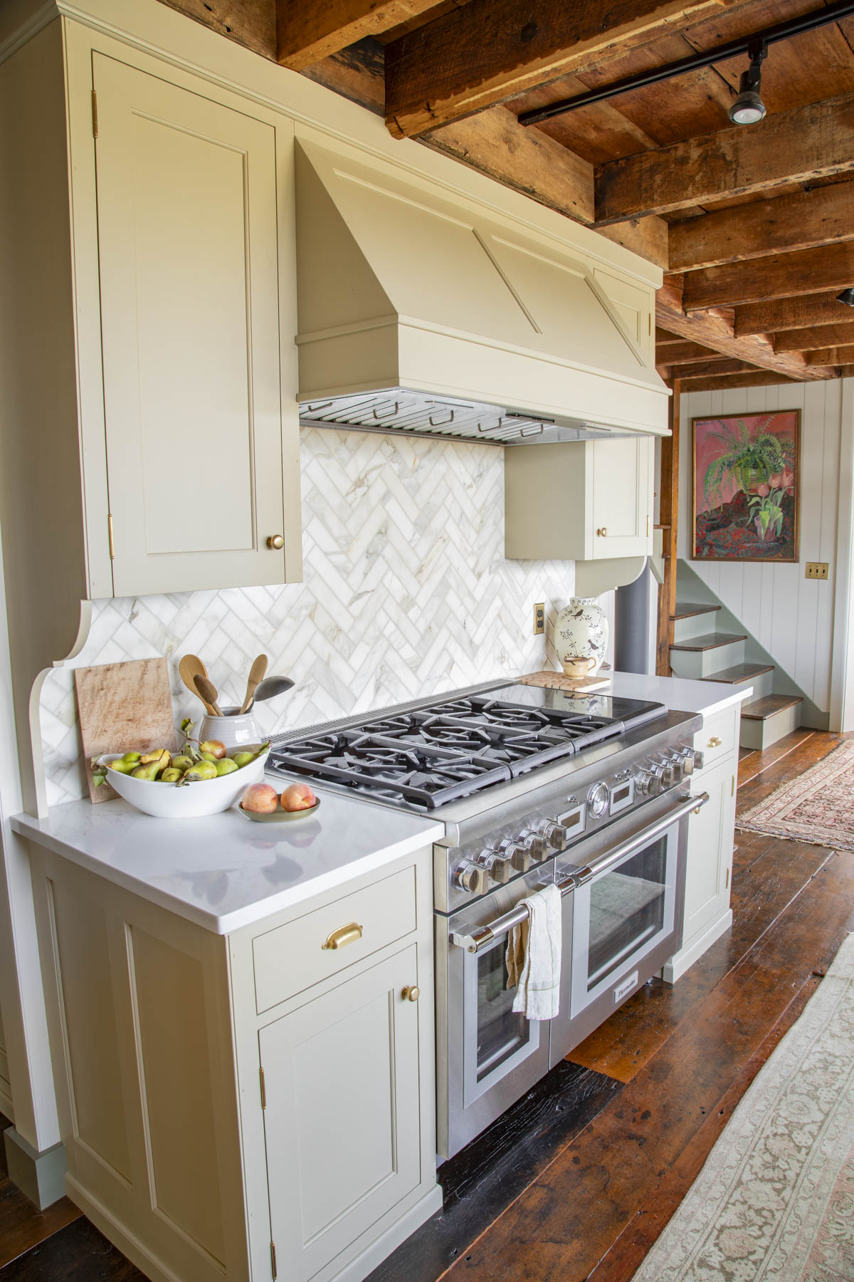 khaki kitchen cabinets with calacatta marble subway tiles