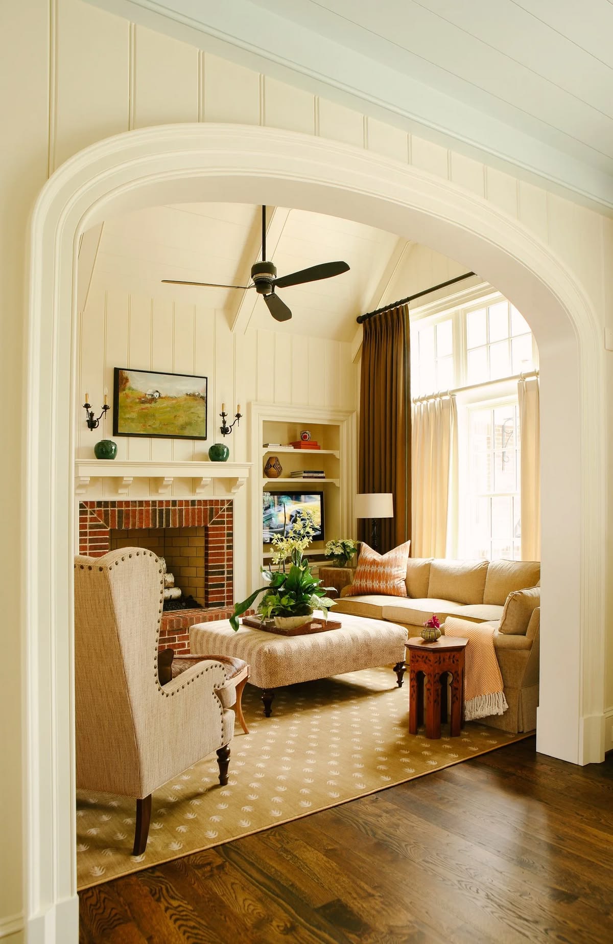 creamy paint color drenches this neutral living room by Robin Burnett design
